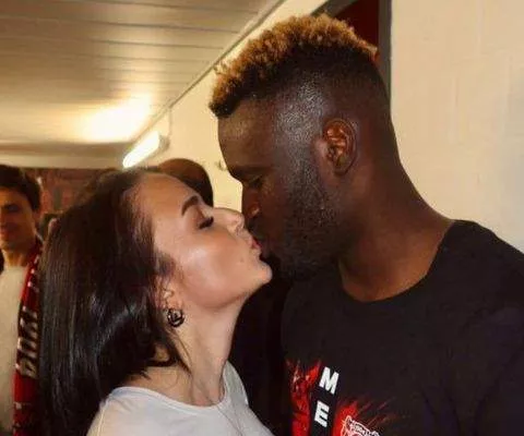 Victor Boniface and Rikke Hermine share a kiss after Bayer Leverkusen's historic title run