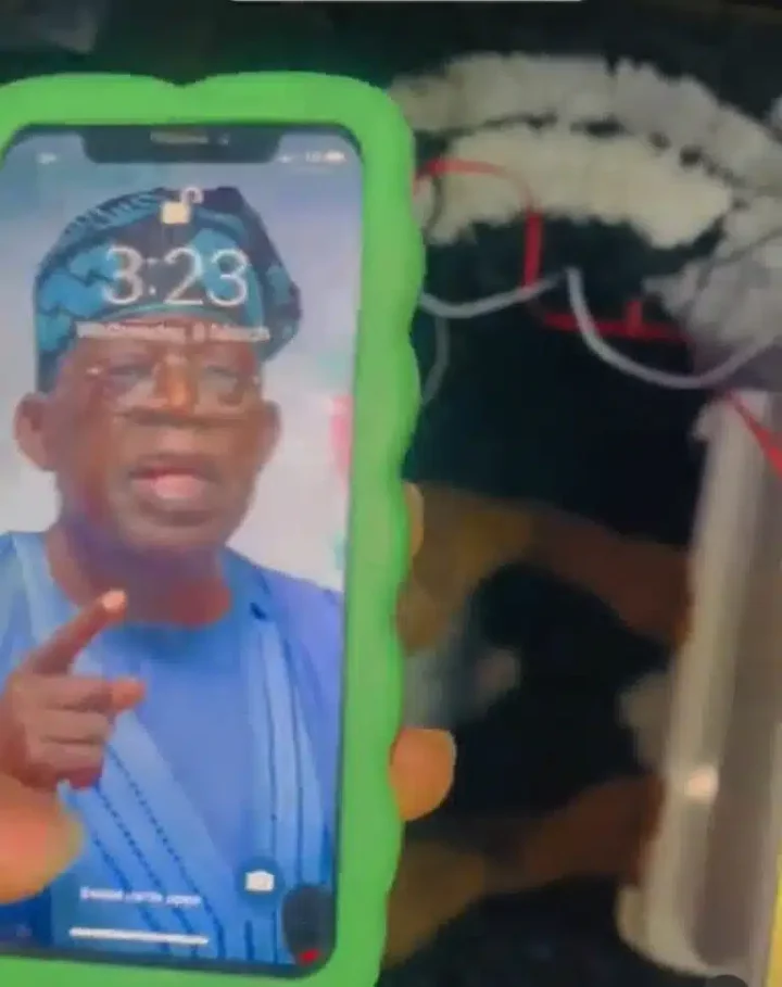 Man takes action as he condemns girlfriend for using Tinubu as wallpaper