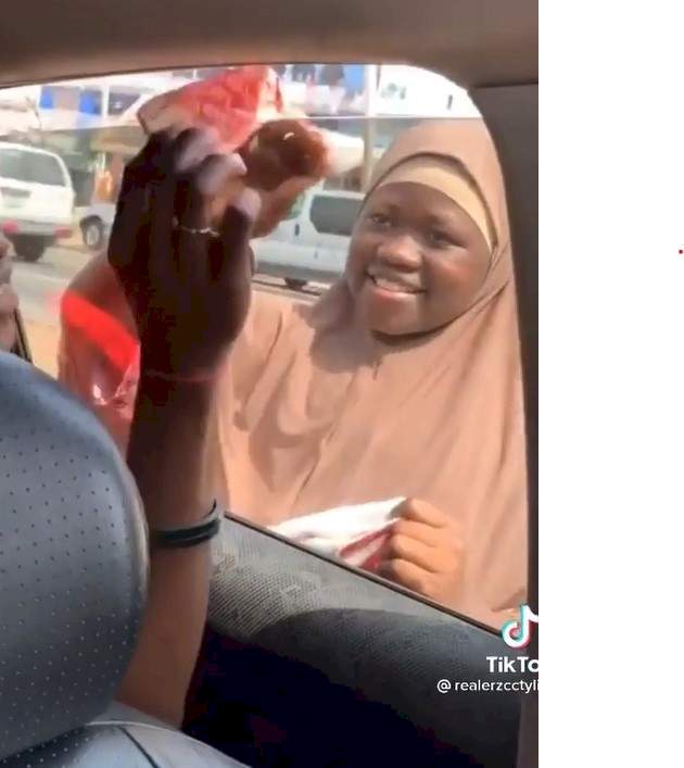 'This isn't funny' - Reactions as man makes street beggar kiss him before giving her money (Video)