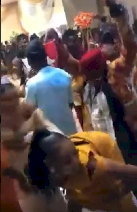 Nigerian bride pushes away bridesmaid who was tw*rking on her husband's best man at her wedding (video)