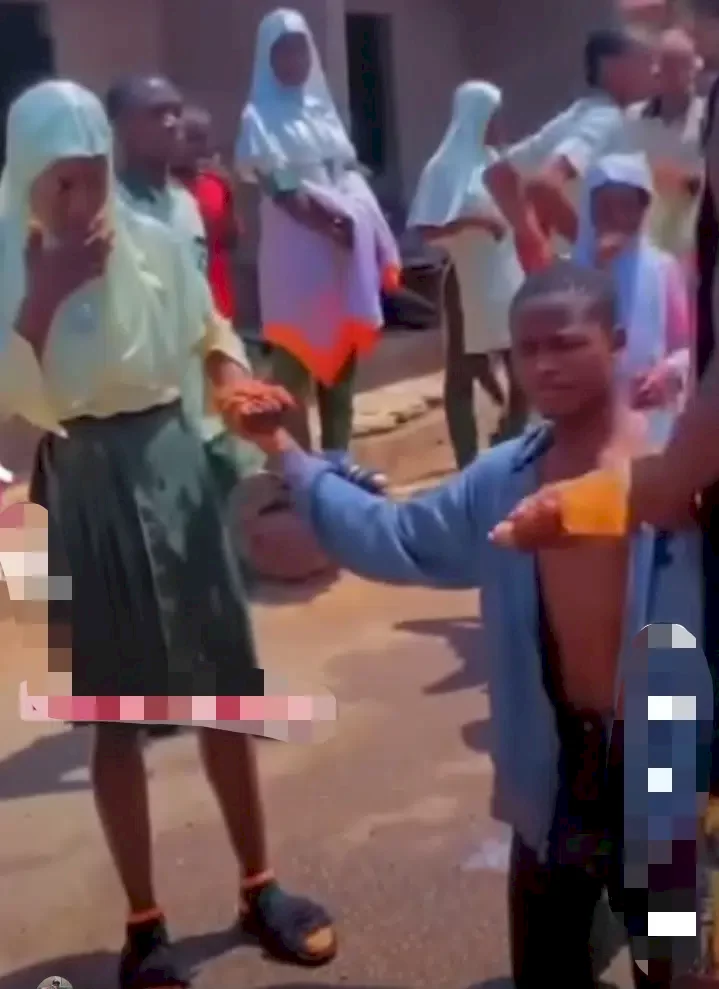 Young boy proposes to girlfriend after WAEC exam; friend pops bottle of wine (Video)