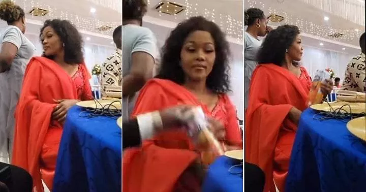 Man's reaction trends as he catches wife hiding pack of juice under table during wedding (Video)