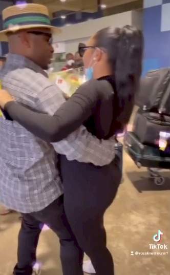 Moment Churchill welcomes his wife, Rosy Meurer with a bouquet of flower as she returns to Nigeria with their son (Video)