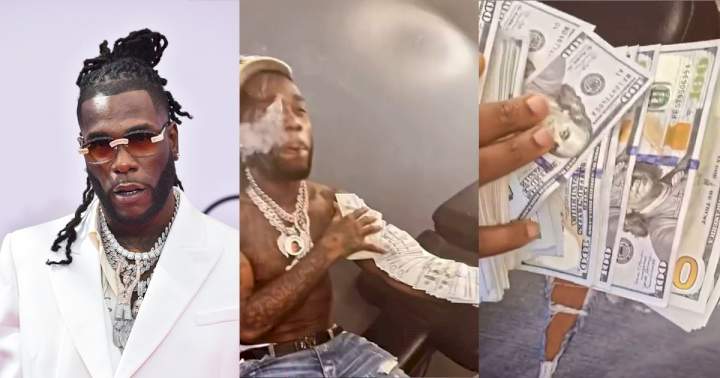 "Weren't his mates at Oba?" - Reactions as Burna Boy shows off dollar notes (Video)