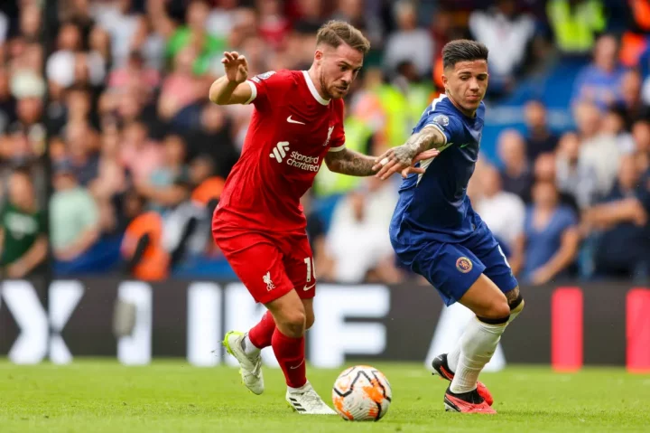  Mac Allister of Liverpool and Enzo Fernandez of Chelsea tussle for the ball during the Premier League match between Chelsea and Liverpool