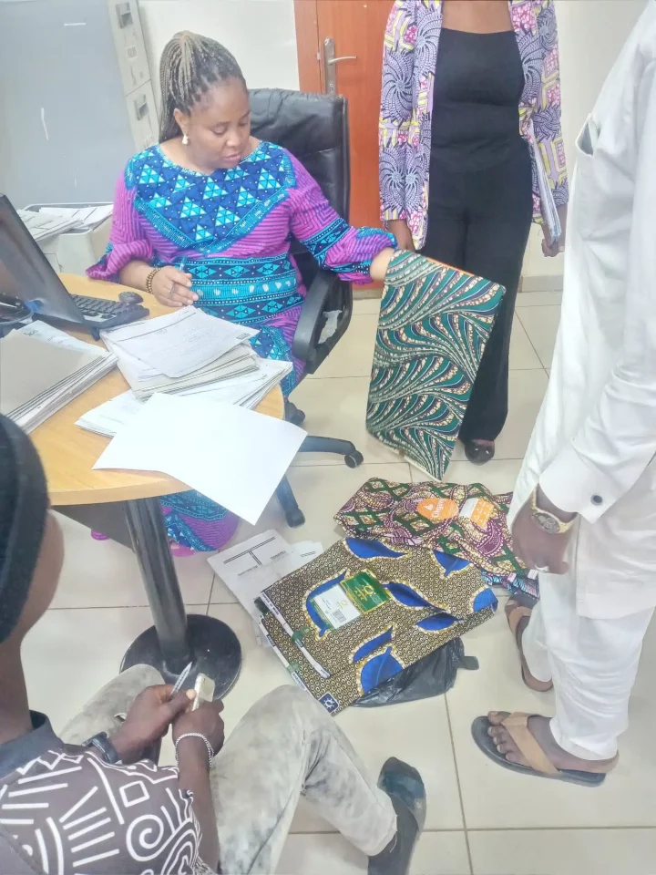 Female banker makes customers wait in queue as she purchases fabrics inside banking hall (Video)