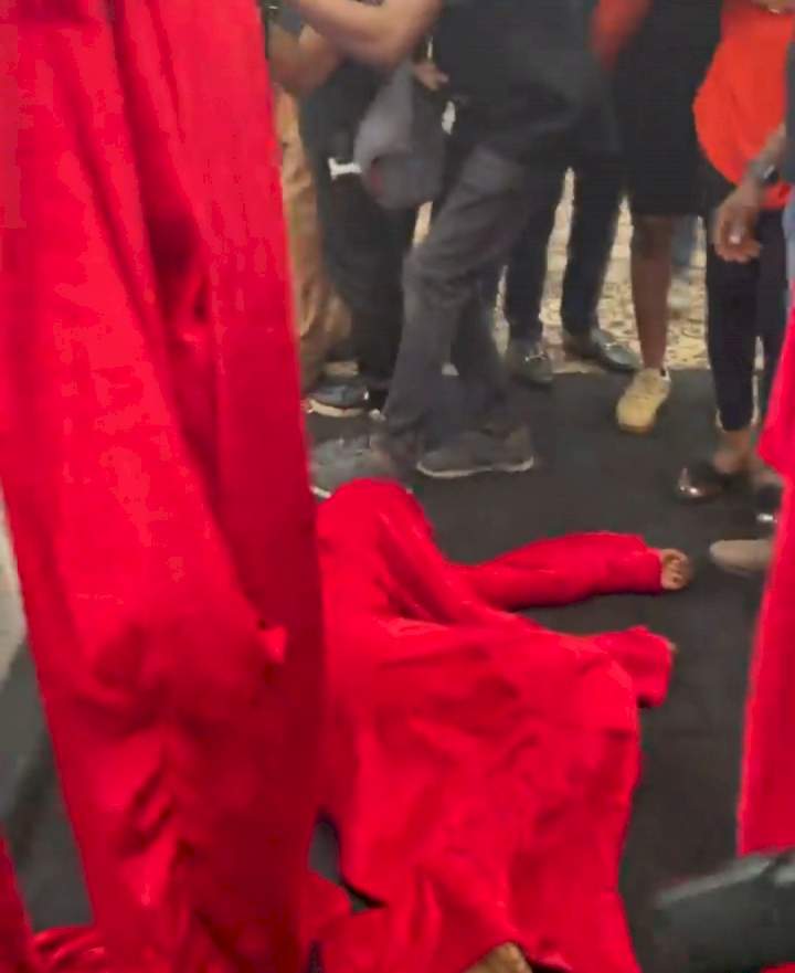 Socialite, Pretty Mike, storms Lagos party with men draped in red attire carrying another man who is almost naked (photos/videos)