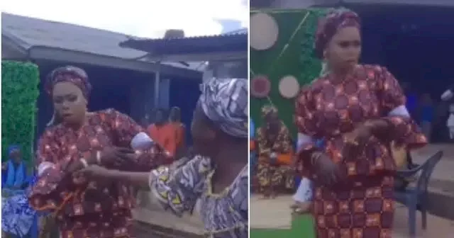 Bride blows hot on guest who wiped his face with money, refuses the money (video)