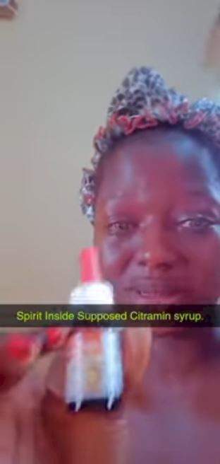 Lady cries out after allegedly discovering methylated spirit in vitamins syrup she bought for her child (Video)