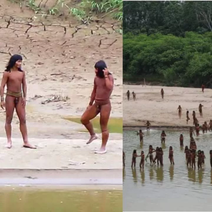 Striking footage shows rare uncontacted hunter-gatherer tribe wielding spears on riverbank in Peru (video)