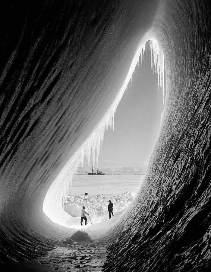 Geologist Thomas Griffith Taylor And Meteorologist Charles Wright In The Entrance Of An Ice Grotto. Terra Nova Expedition, Ross Island, 5 January 1911. Photo Taken By Herbert Ponting