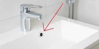 Why is there a hole at the top in every bathtub and sink?