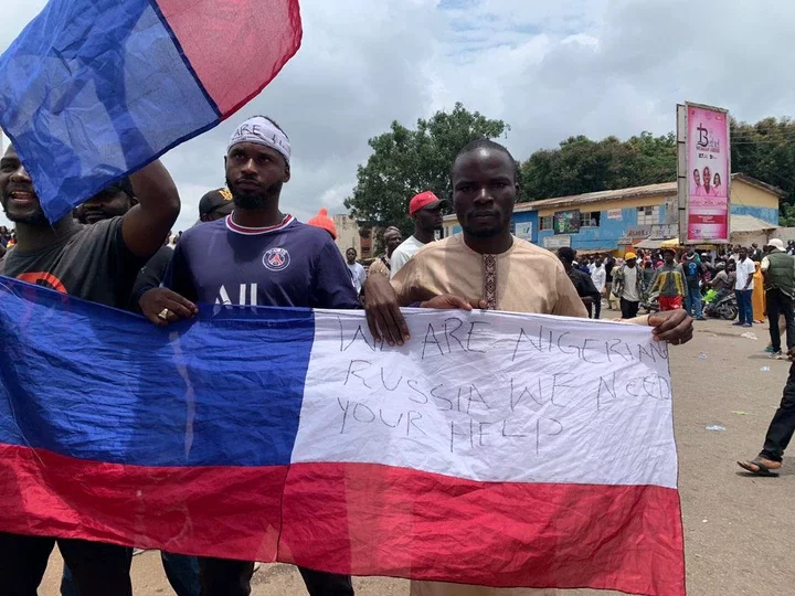 The implications of protesters waving Russian flags in some northern states.