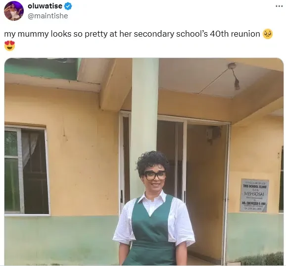 Woman dresses up in uniform as she attends her secondary school's 40th reunion