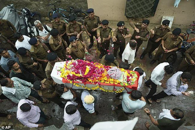 Mourners carry the coffin of Rajendra Patankar, one of the victims of the Air India plane crash, during his funeral procession in Ahmedabad last Thursday