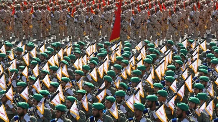 Iran's paramilitary Revolutionary Guard troops march during a military parade commemorating the anniversary of the start of the 1980-88 Iraq-Iran war, in front of the shrine of the late revolutionary founder Ayatollah Khomeini, just outside Tehran, Iran, Thursday, Sept. 22, 2022. (AP Photo/Vahid Salemi)