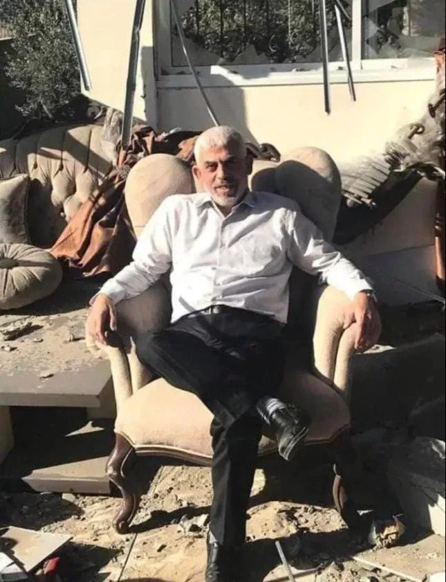 Hamas has taunted Israel with a picture of Sinwar sitting amongst ruins in 2021