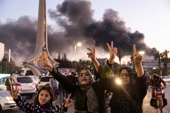 Syrians celebrate the downfall of the dictator