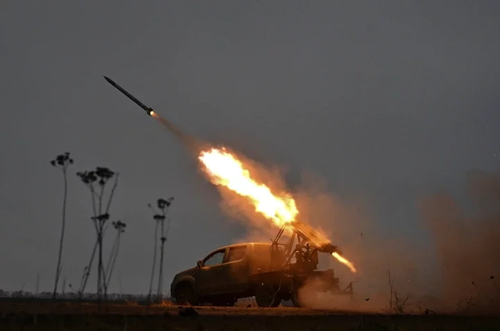 Members of the artillery unit of the special rifle battalion of Zaporizhzhia region police fire towards Russian troops in a frontline