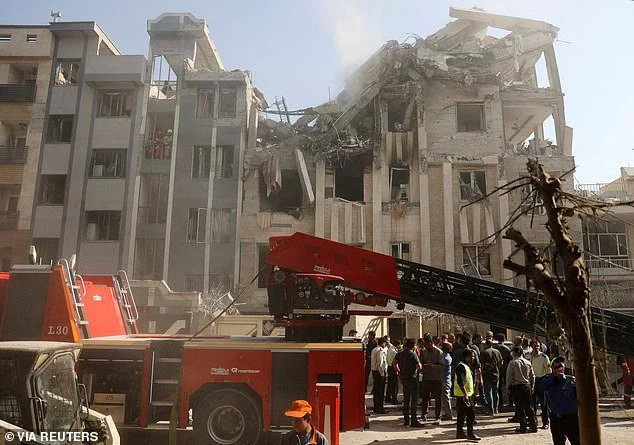 Rescuers work at the scene of a damaged building in the aftermath of Israeli strikes, in Tehran, Iran, June 13, 2025