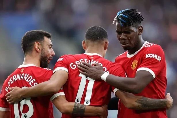 Mason Greenwood of Manchester United celebrates with teammates Paul Pogba and Bruno Fernandes