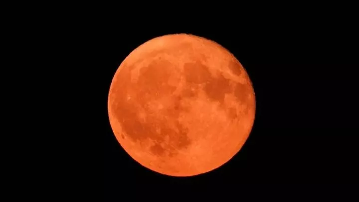 A full lunar eclipse seen over Hamburg, Germany in 2023. Pic: Marcus Brandt/picture-alliance/dpa/AP