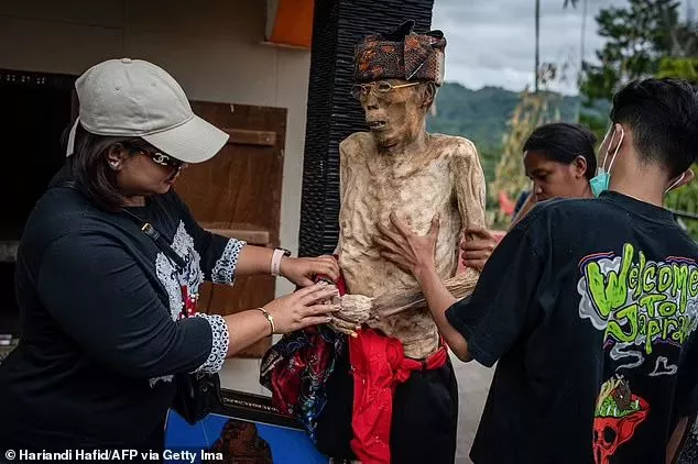 Every four years, the Toraja people dig up the graves of their ancestors to meticulously look after their bodies