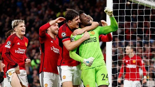 MANCHESTER, ENGLAND - OCTOBER 24: Harry Maguire and Christian Eriksen of Manchester United and Andre Onana celebrates last minute save during the UEFA Champions League match between Manchester United and F.C. Copenhagen at Old Trafford on October 24, 2023 in Manchester, England. (Photo by Richard Sellers/Sportsphoto/Allstar via Getty Images)