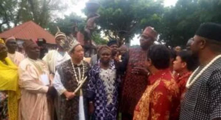Zheng Xiapeng, Chinese national who bagged two chieftaincy titles in Nigeria with dignitaries at the 16th INAC. [NAN]