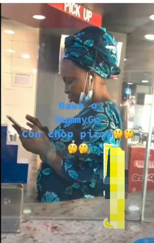 'She don tire to dey chop the word of God' - Reactions as Mummy G.O is caught on camera buying pizza and using 'worldly gadgets' (Video)