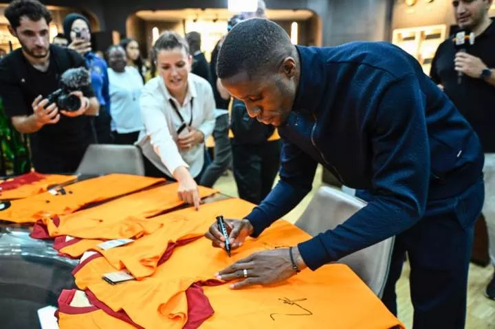 Wilfried Zaha sends Galatasaray fans wild as he poses in club scarf after touching down in Turkey ahead of free transfer
