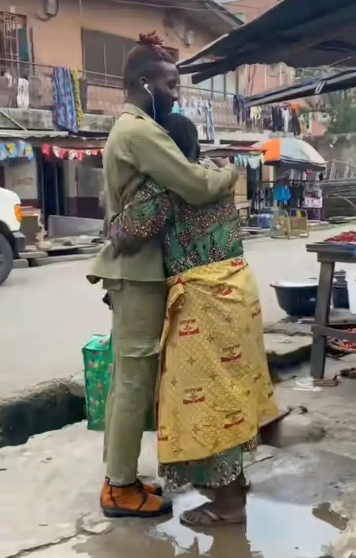 Corper marches to mom's marketplace, salutes her after completing his national service (Video)