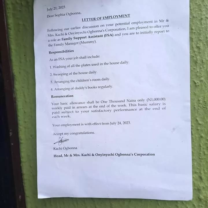 Nigerian father displays contract paper as he offers 6-year-old daughter a weekly pay job