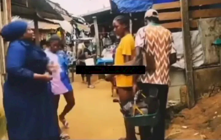 Drama as female preacher aggressively confronts young girls in market over indecent dressing (Video)