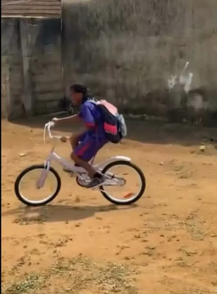 Moment big brother surprises sister with bicycle, cake after missing her birthday