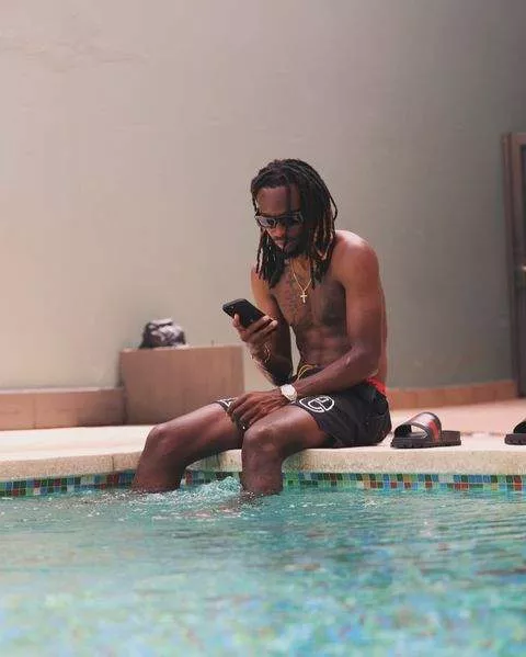 Olisa Ndah soaking it all in in a pool in Malaga.
