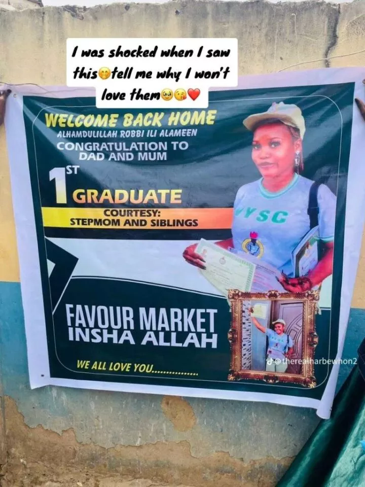 'First graduate' - Family sets up huge banner as their daughter completes NYSC