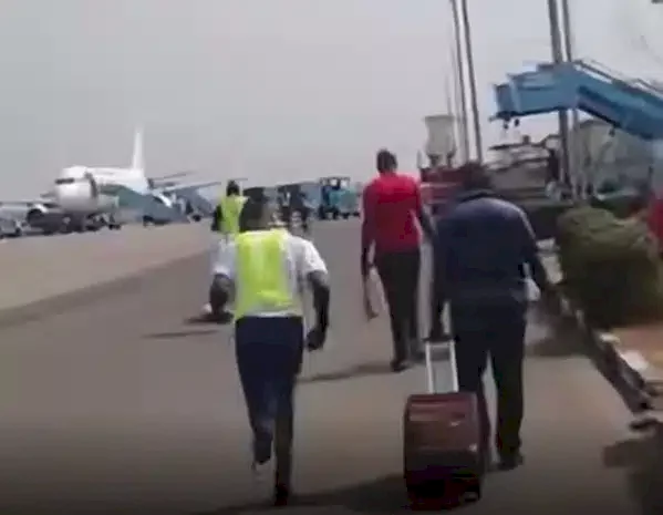'Everything is hard in Nigeria' - Reactions as passengers run to board plane as it prepares to take off (Video)