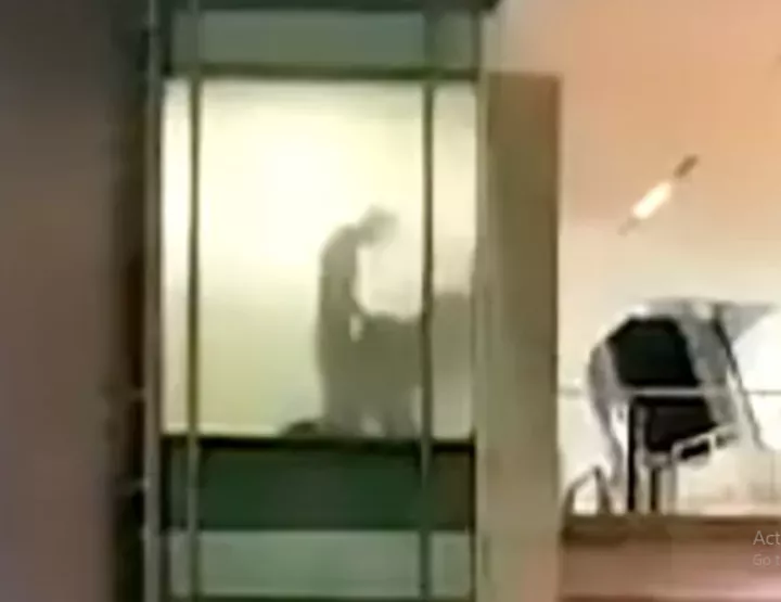 Couple caught romping at work through office window