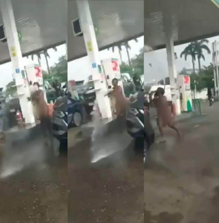 Naked woman causes chaos as she hijacks fuel pump and sprays petrol on customers at petrol station in Falomo, Ikoyi (video)