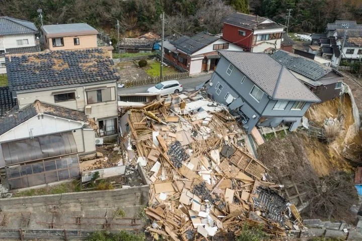 This aerial photo shows damaged and destroyed homes along a street in Wajima, Ishikawa prefecture.