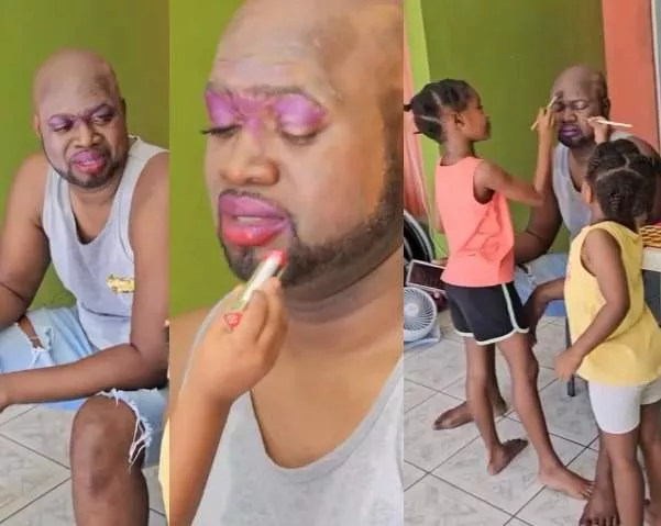 Trending video of Nigerian dad being made up by his young daughters (Video)