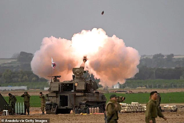 Smoke rises as Israeli artillery units and howitzers stationed in the military zone launch attacks near the Gaza border in Nahal Oz, Israel on December 10, 2023