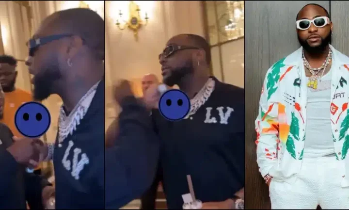 Reactions trail Davido's unusual handshake with a man in black