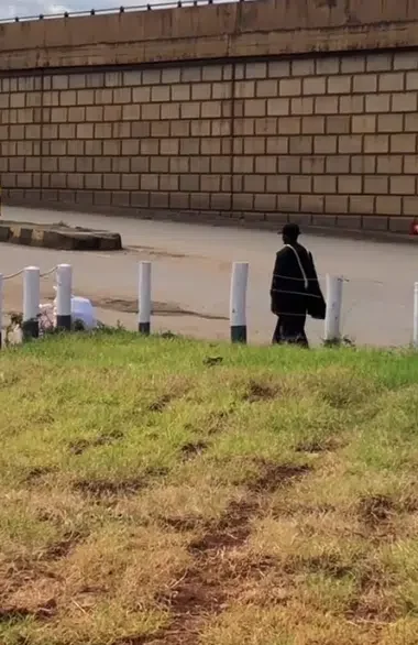 'Is he an Orphan? ' - Young man walks home alone after finishing school in his graduation gown