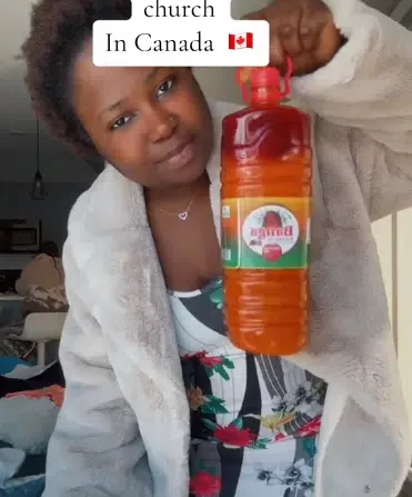 Lady flaunts bag of rice, other gifts Nigerian church in Canada gave her as first-timer