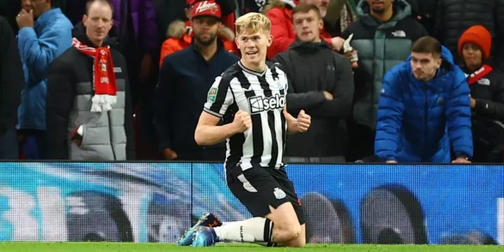 Newcastle United left-back Lewis Hall celebrating