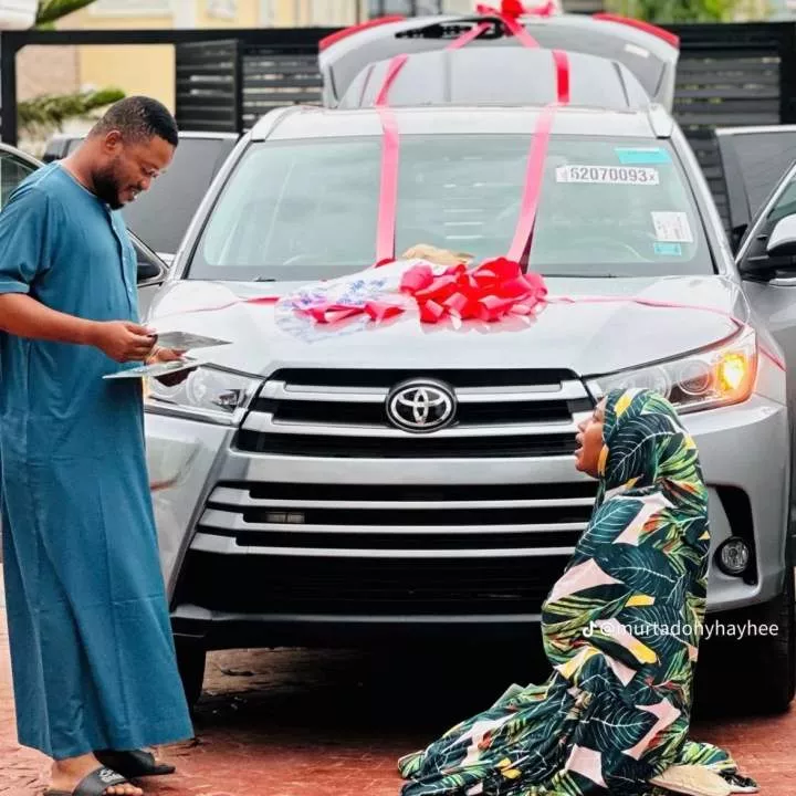 Heartwarming moment as Nigerian wife kneels in thanks as husband gifts new car