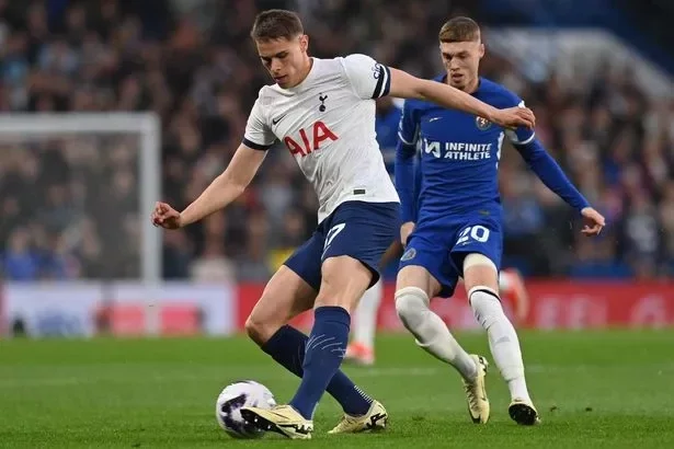 Tottenham Hotspur's Dutch defender #37 Micky van de Ven (L) clears the ball under pressure from Chelsea's English midfielder #20 Cole Palmer (R) during the English Premier League football match between Chelsea and Tottenham Hotspur at Stamford Bridge in London on May 2, 2024