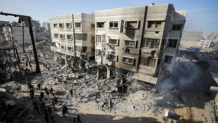 Palestinians inspect damage in the area around Al Shifa Hospital. Pic: Reuters